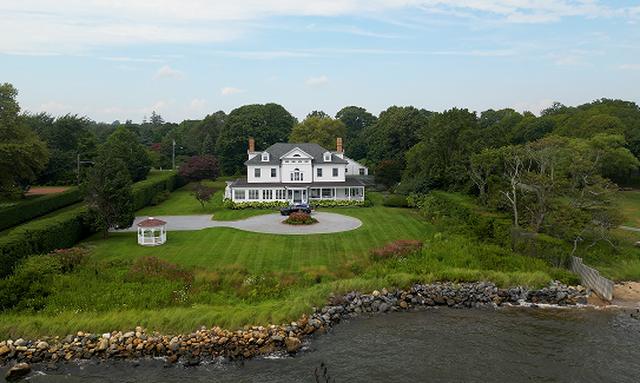 Aerial view of a Long Island waterfront home remodeled by Good Guys Contracting